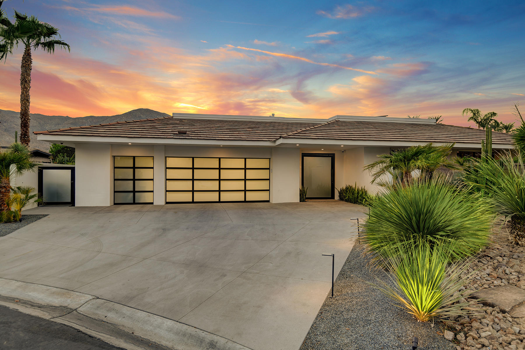 4 Deerfield Court Rancho Mirage, CA 92270 - Photo 51 of 53 a view of a house with a yard and garage