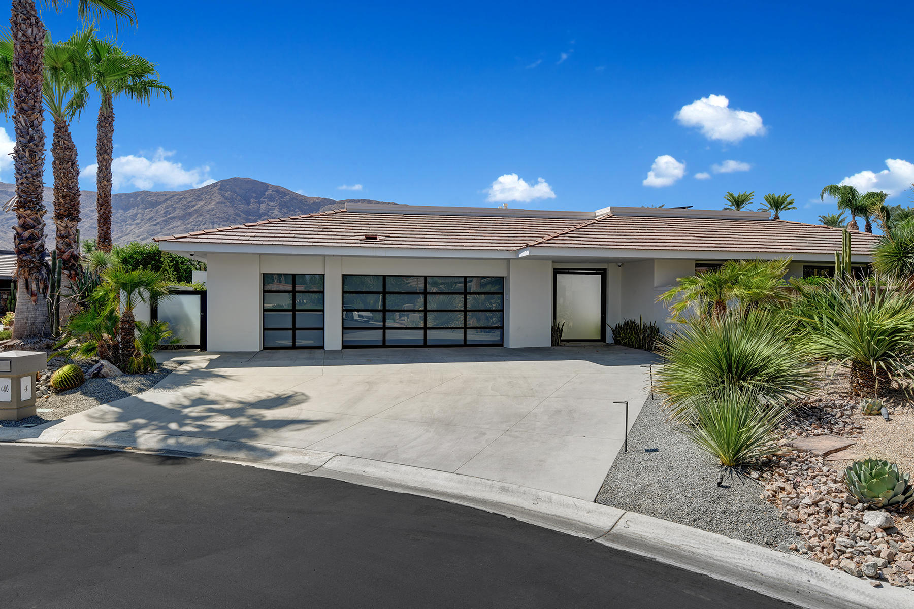 4 Deerfield Court Rancho Mirage, CA 92270 - Photo 52 of 53 a front view of a house with a yard