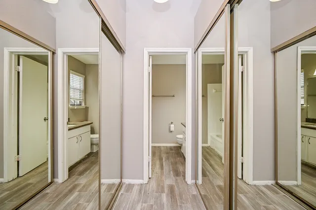 a view of a bathroom from a hallway