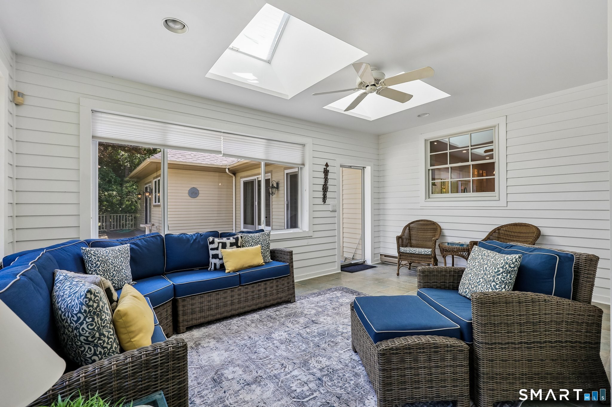 72 Strawberry Hill Road Madison, CT 06443 - Photo 14 of 40 The heated sunroom has two skylights and a ceiling fan