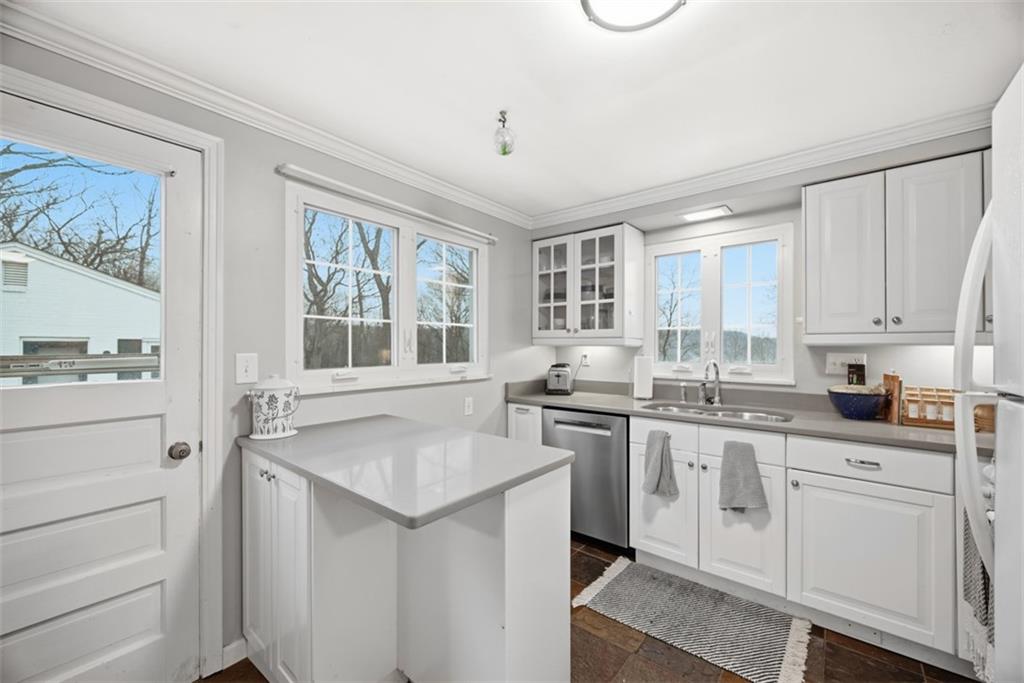 111 Rockingham Road Pittsburgh, PA 15238 - Photo 13 of 38 a kitchen with granite countertop white cabinets and white appliances