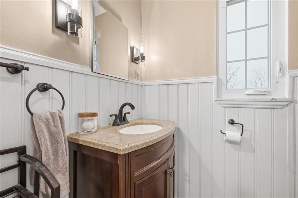 111 Rockingham Road Pittsburgh, PA 15238 - Photo 25 of 38 a bathroom with a sink and a mirror