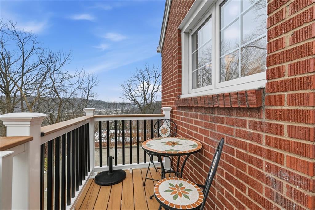 111 Rockingham Road Pittsburgh, PA 15238 - Photo 30 of 38 a view of a patio with a table and chairs and wooden floor