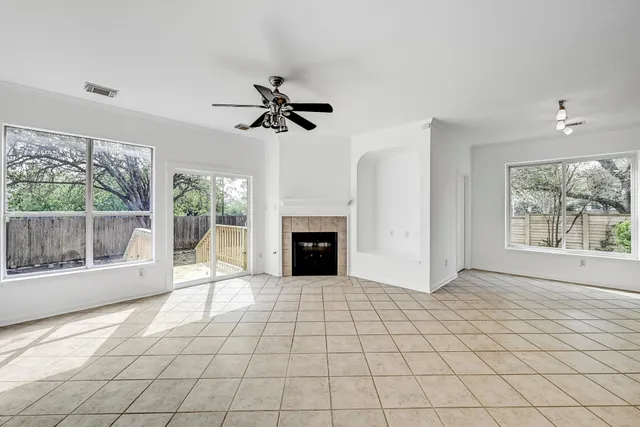 a view of a livingroom with an empty space and a fireplace