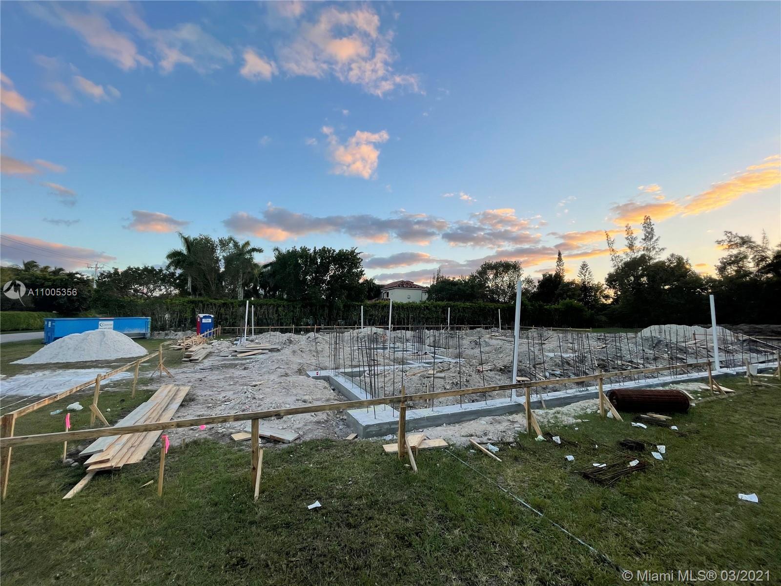 441 Ranch Road Weston, FL 33326 - Photo 5 of 12 a view of swimming pool with lawn chairs and fire pit