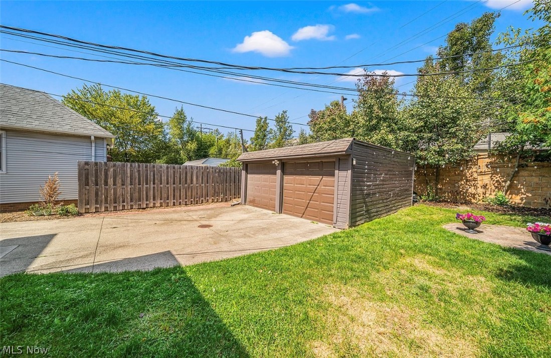 4069 Bushnell Road Cleveland, OH 44121 - Photo 34 of 39 Fenced backyard featuring an outdoor structure and a garage