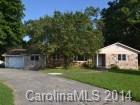 4438 Flowes Store Road Concord, NC 28025 - Photo 2 of 15 a front view of a house with yard and green space
