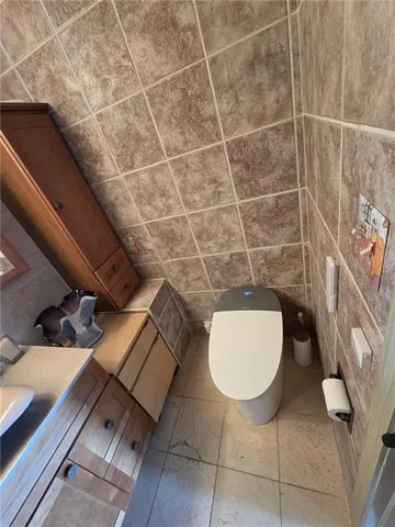 a bathroom with a toilet and a sink