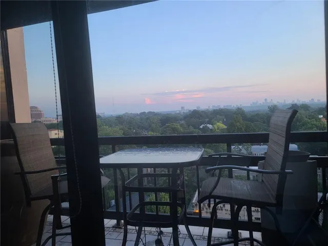 a view of a table and chairs in the garden