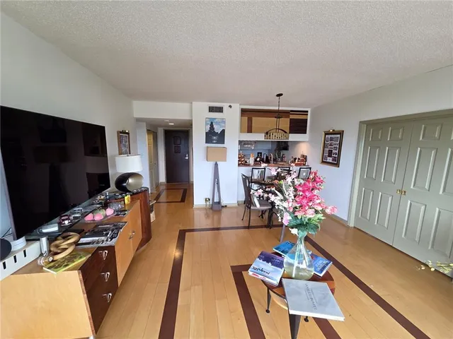 a living room with furniture flat screen tv and a fireplace