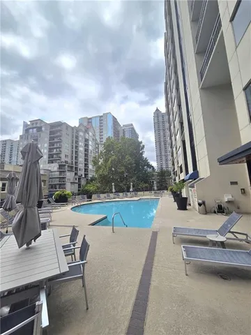an empty room with large windows
