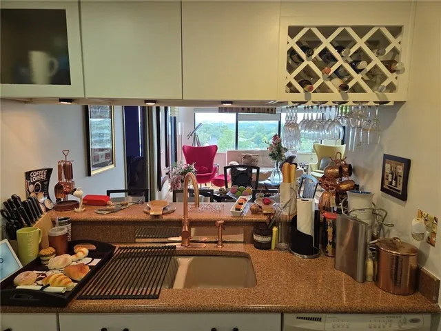 a room with lots of furniture and fan