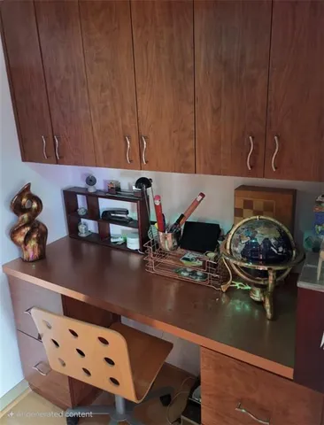 a kitchen with a sink and a stove with wooden cabinets