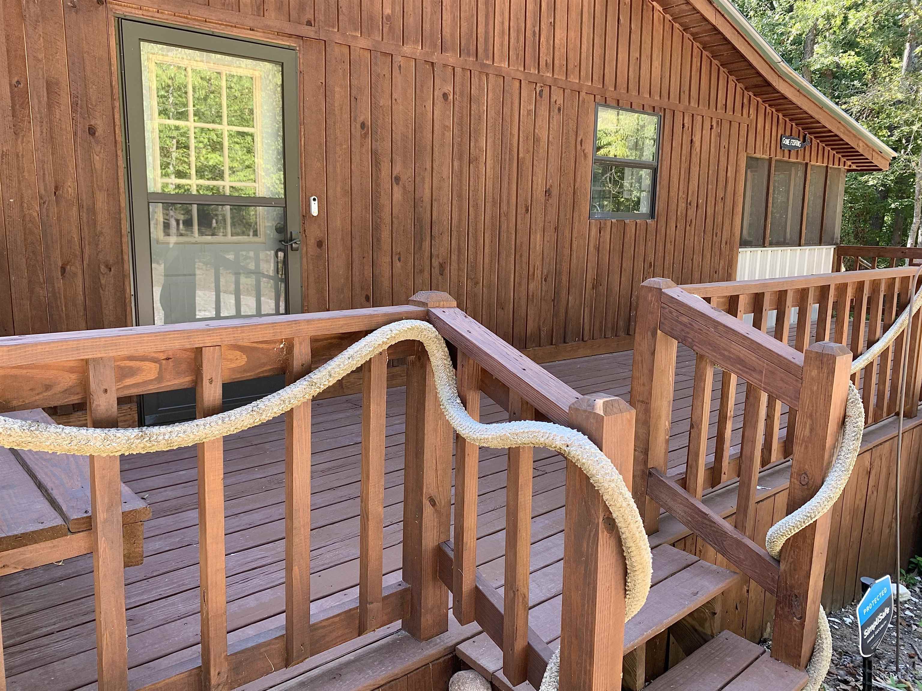 115 Fortune Way Hornsby, TN 38044 - Photo 12 of 30 a view of balcony with two chairs and wooden fence