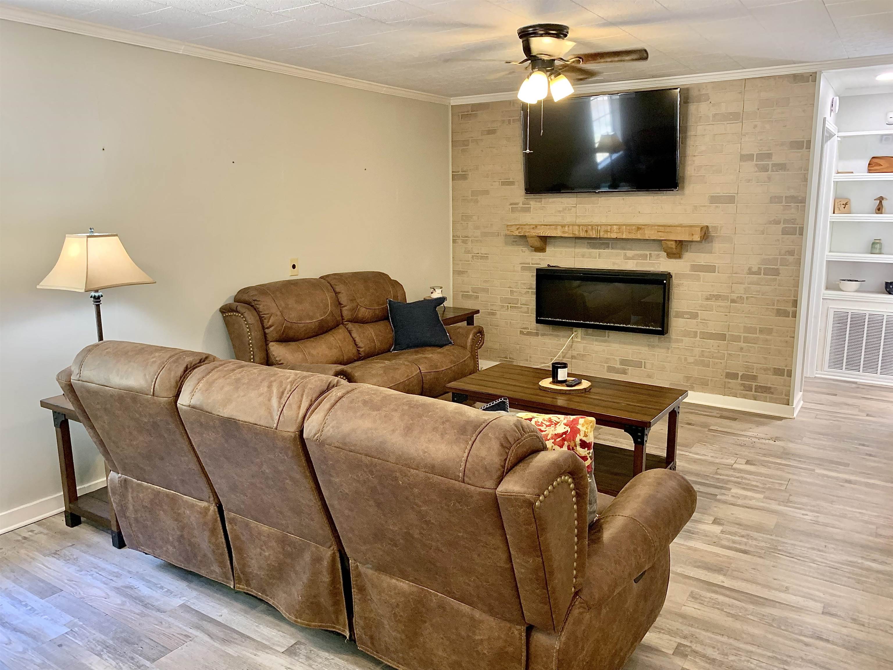 115 Fortune Way Hornsby, TN 38044 - Photo 21 of 30 a living room with furniture and a flat screen tv