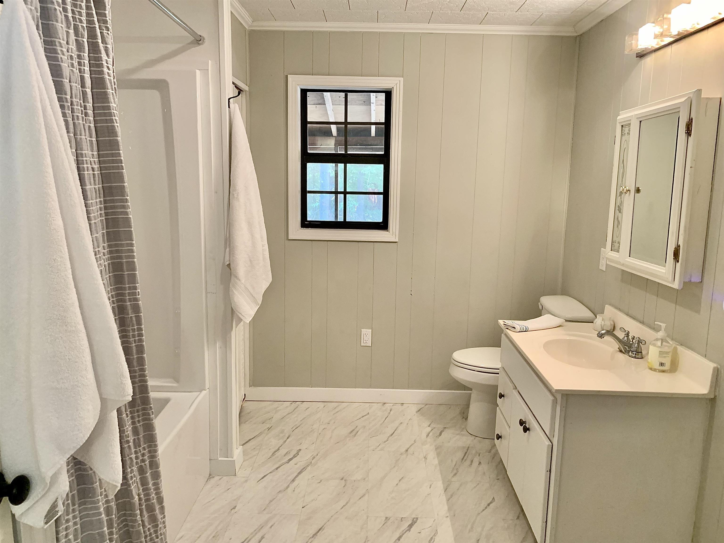115 Fortune Way Hornsby, TN 38044 - Photo 26 of 30 a bathroom with a sink a toilet and shower