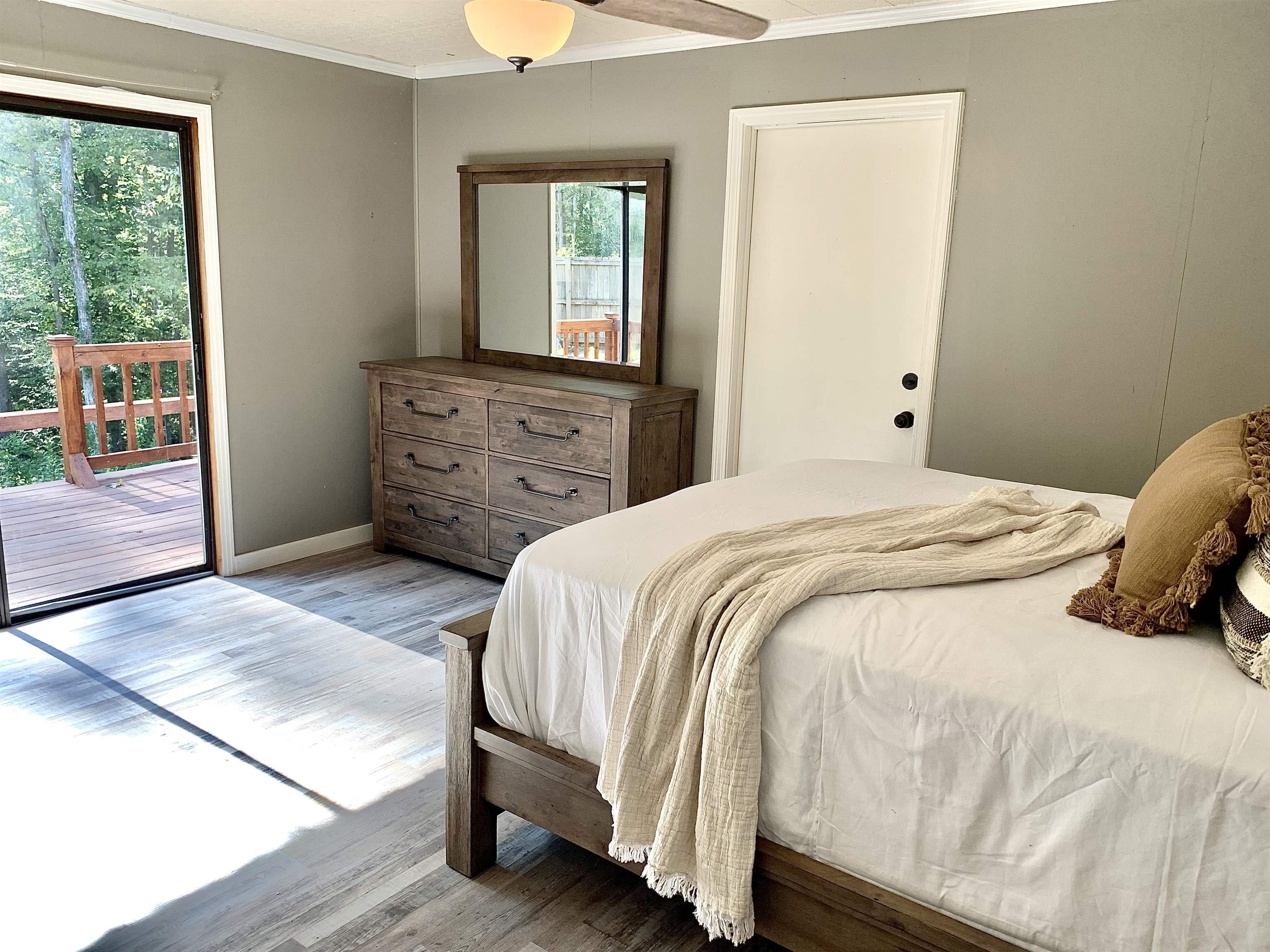 115 Fortune Way Hornsby, TN 38044 - Photo 8 of 30 a bedroom with a bed and wooden floor