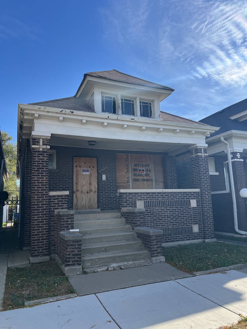 7835 South Rhodes Avenue Chicago, IL 60619 - Photo 3 of 18 a front view of a house