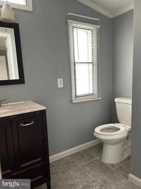 107 Rodeo Circle Middle River, MD 21220 - Photo 13 of 17 a bathroom with a toilet sink and mirror