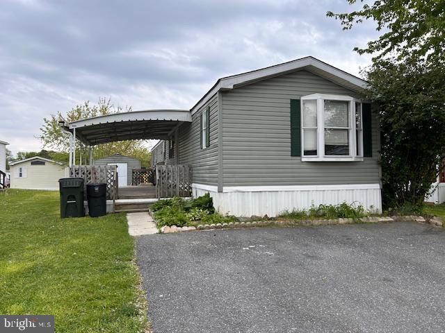 107 Rodeo Circle Middle River, MD 21220 - Photo 2 of 17 a front view of a house with a yard