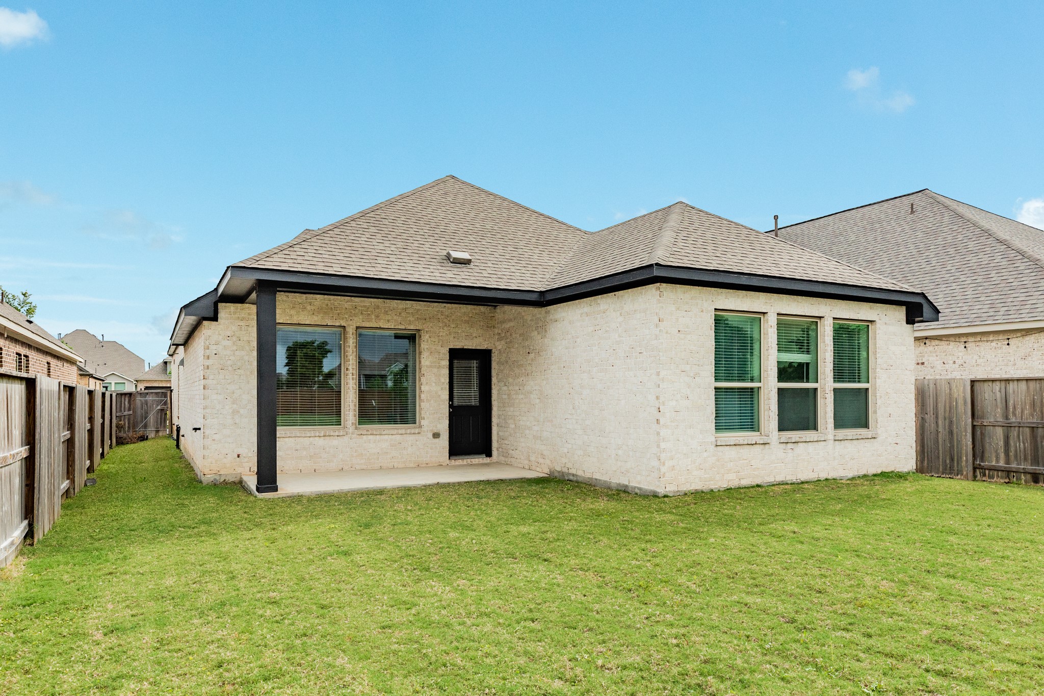 4946 Hitchings Court Rosharon, TX 77583 - Photo 22 of 49 This all brick and stone home features a covered patio overlooking a very large backyard with great landscaping.