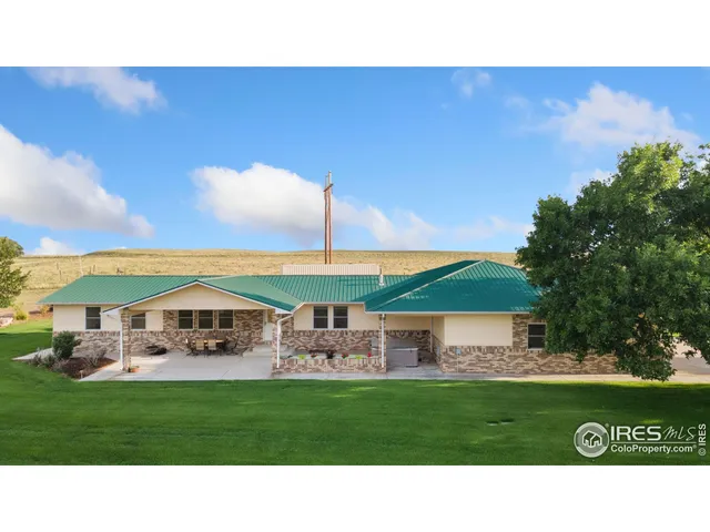 a kitchen with a table and chairs