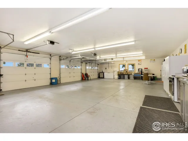 a view of parking garage with cars