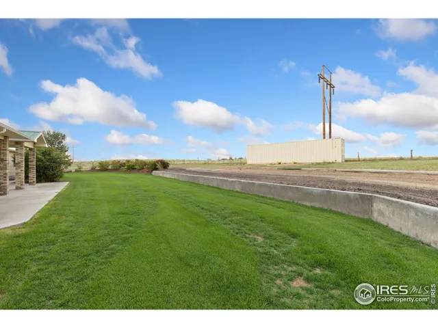 a view of a lake with a big yard