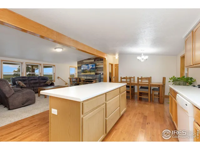 a view of kitchen with furniture and wooden floor