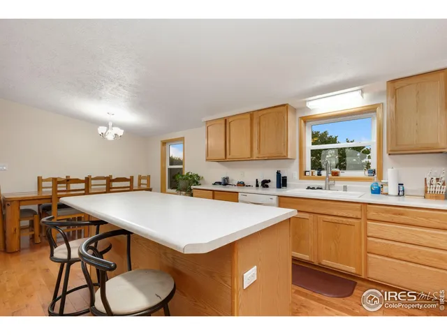 a kitchen with a table and chairs in it