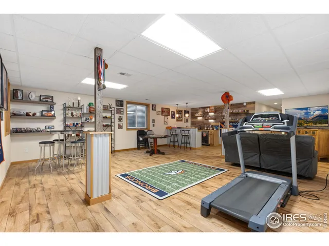 a living room with lots of furniture and kitchen view