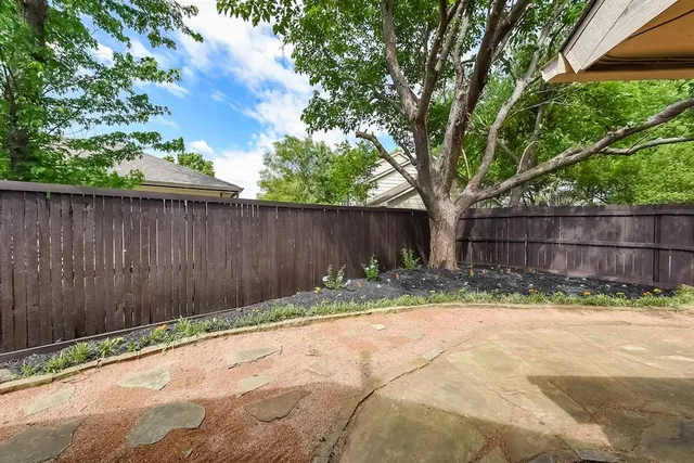 a view of outdoor space with wooden fence