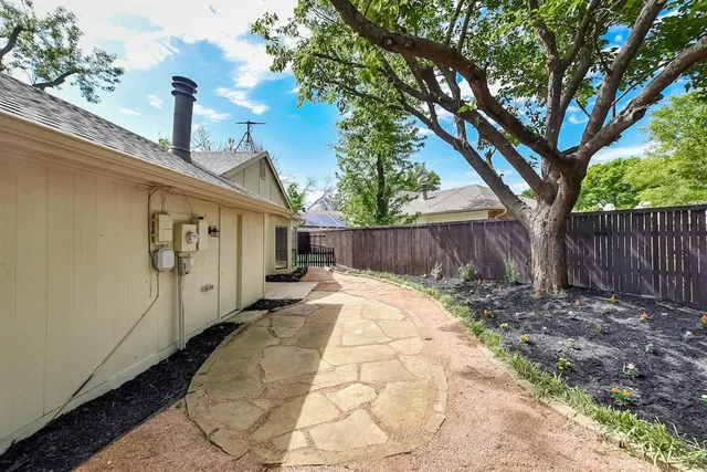 a backyard of a house with lots of green space