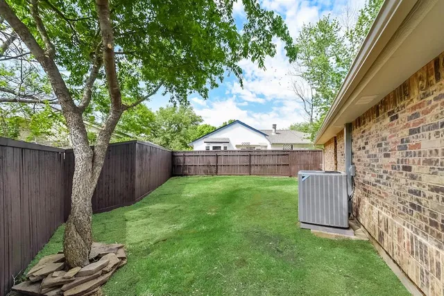 a view of backyard with green space