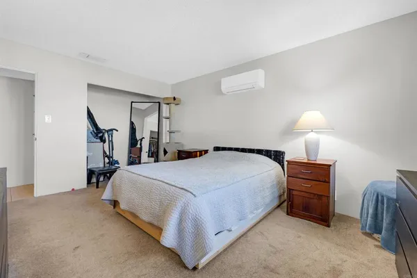 a bed room with a bed and a lamp