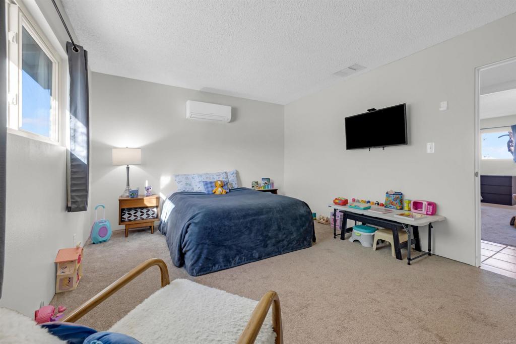 3129 Frying Pan Road Borrego Springs, CA 92004 - Photo 20 of 38 a bedroom with a bed and a flat screen tv
