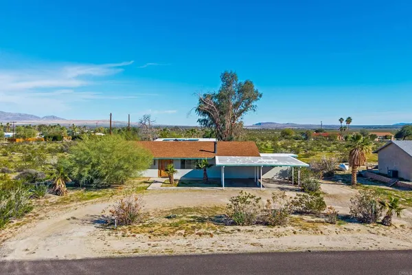 a view of a yard with an ocean view