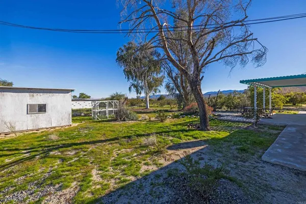 a backyard of a house with lots of green space