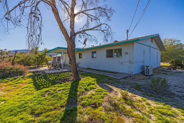 a backyard of a house with lots of green space