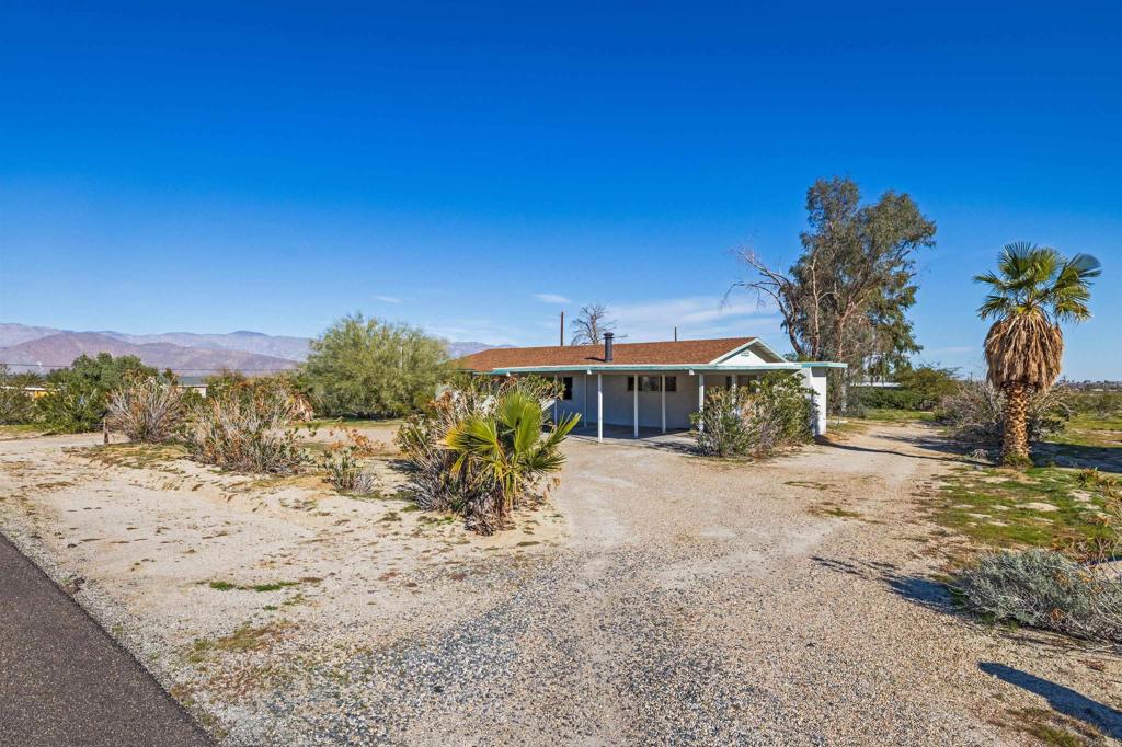 3129 Frying Pan Road Borrego Springs, CA 92004 - Photo 37 of 38 a view of a yard with a house in the background