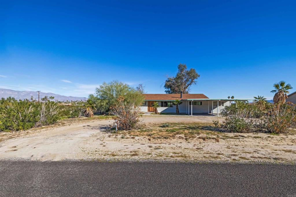 3129 Frying Pan Road Borrego Springs, CA 92004 - Photo 38 of 38 a view of a dry yard with a house in the background