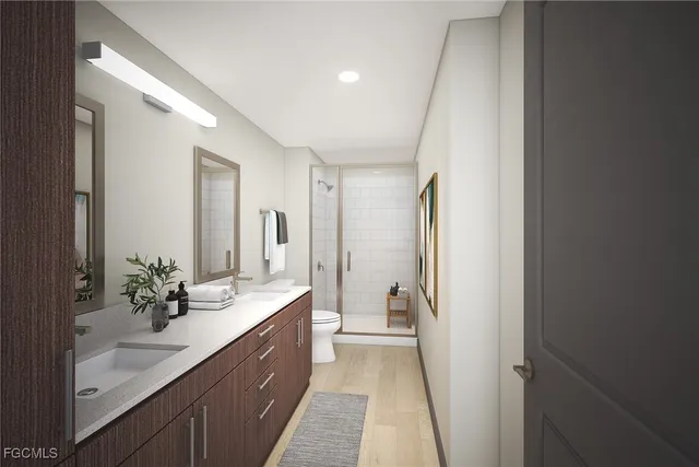 a spacious bathroom with a double vanity sink and a mirror