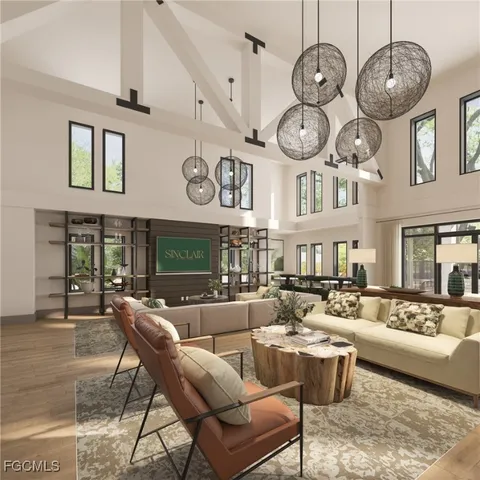 a living room with lots of furniture and a large window