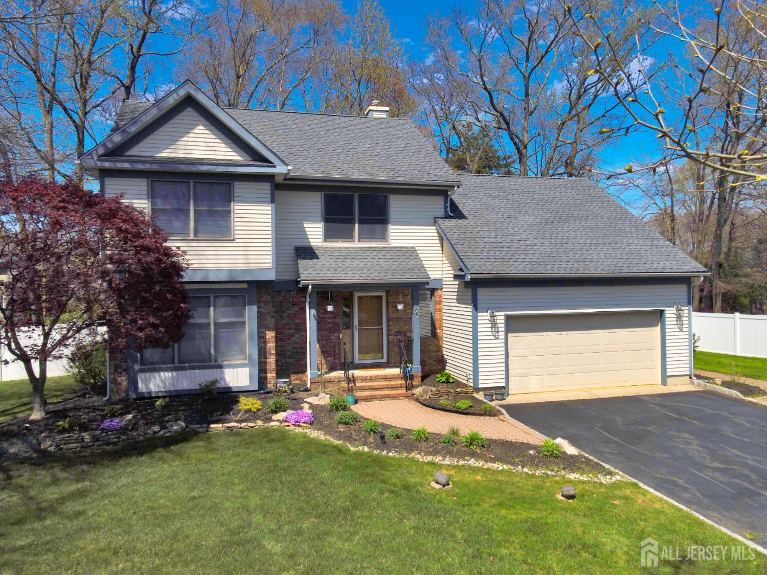 27 Oakland Road Old Bridge, NJ 08857 - Photo 1 of 1 a front view of a house with a yard and garage