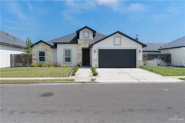 a front view of a house with a outdoor space