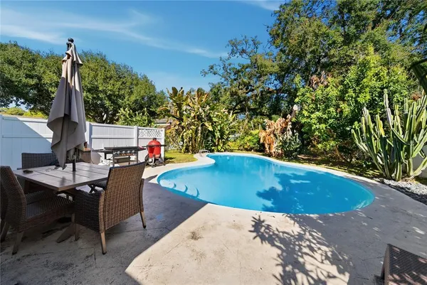 a view of swimming pool with seating space