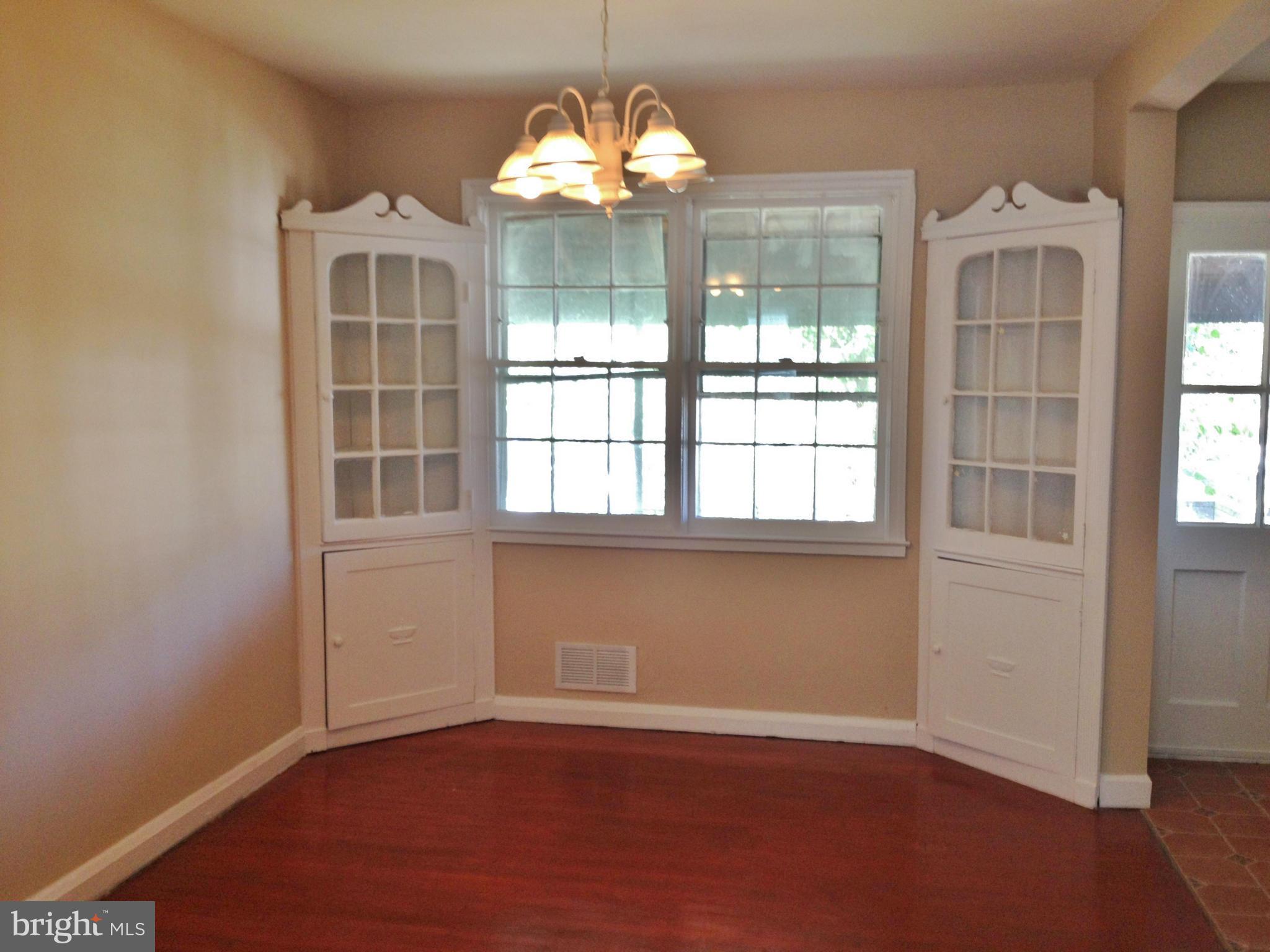 8328 Ridgely Oak Road Parkville, MD 21234 - Photo 3 of 10 an empty room with a window