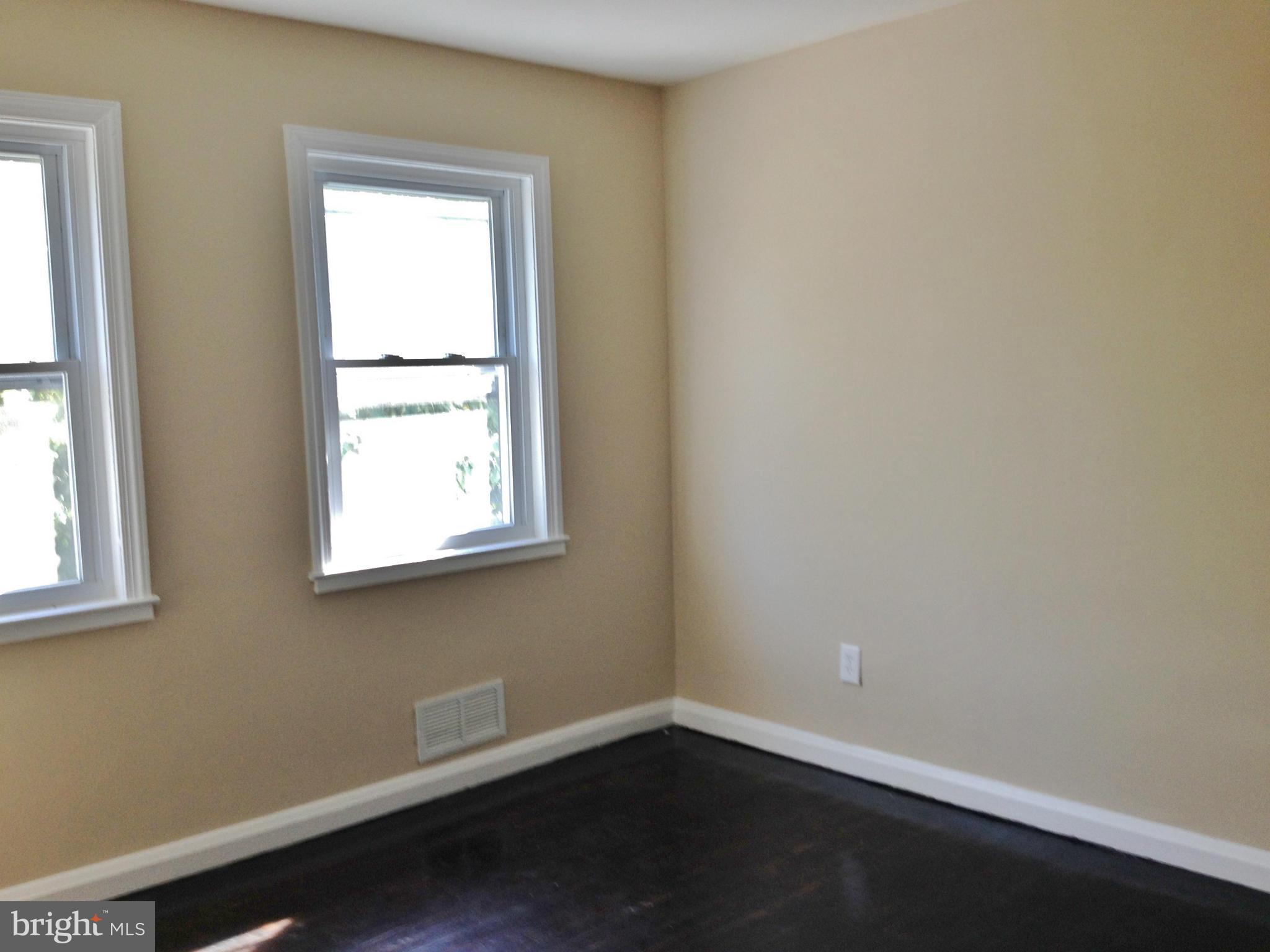 8328 Ridgely Oak Road Parkville, MD 21234 - Photo 5 of 10 an empty room with a window
