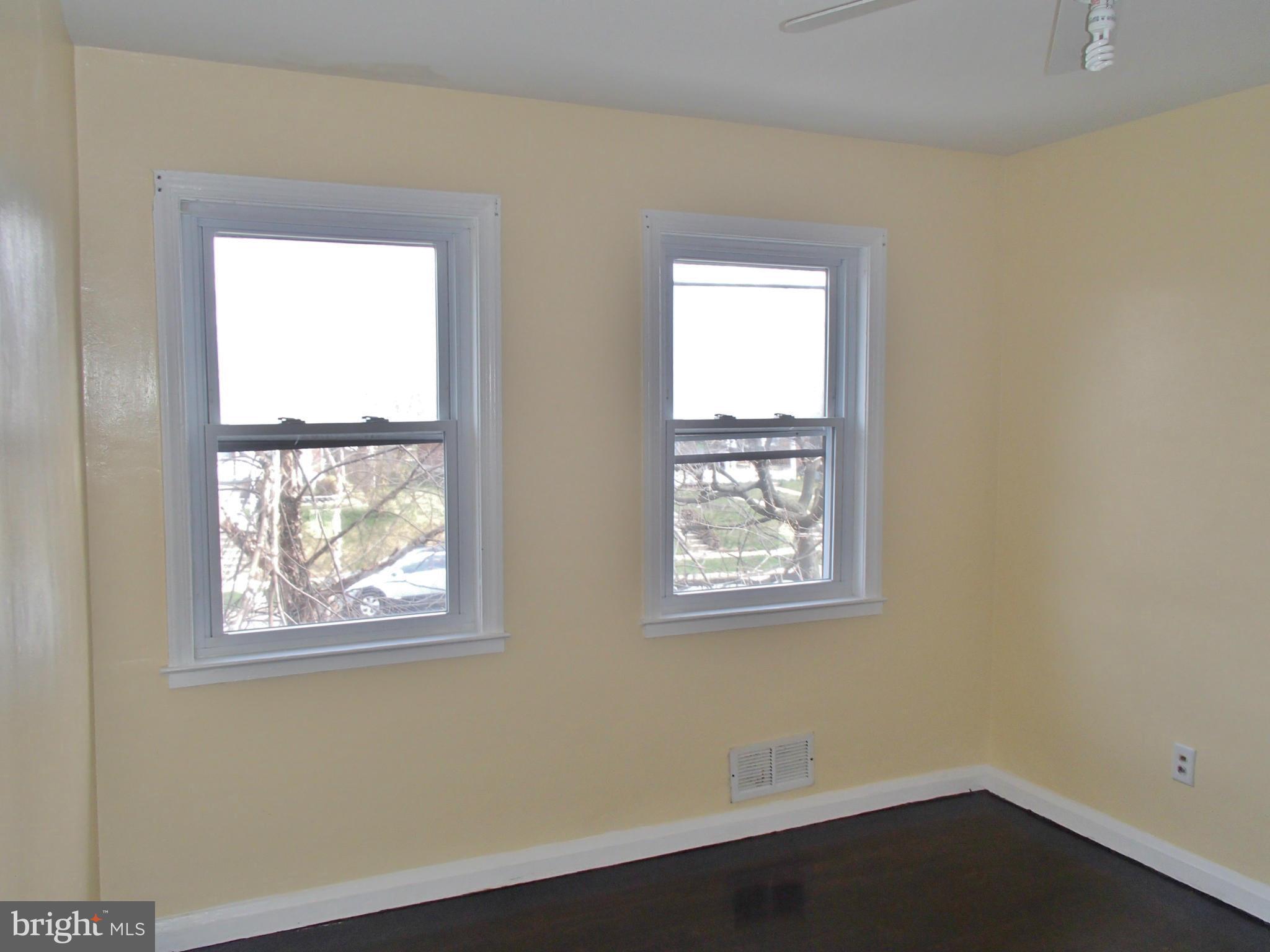 8328 Ridgely Oak Road Parkville, MD 21234 - Photo 7 of 10 an empty room with a window