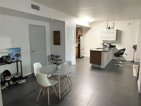 a view of a dining room with furniture